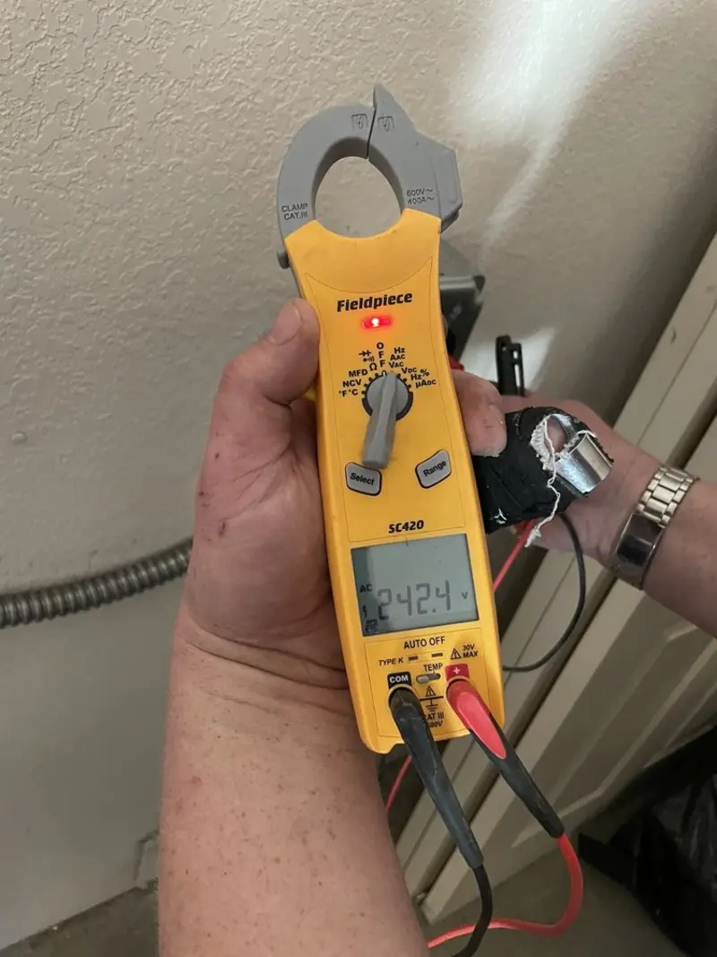 Voltage testing with clamp meter during Whole House Surge Protector in Heflin